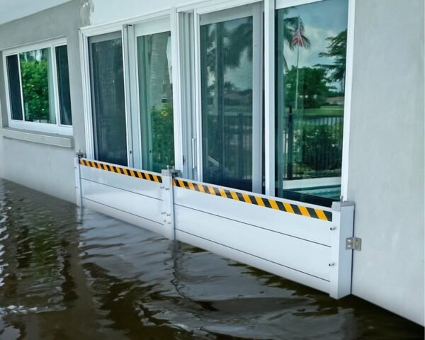 Aluminum flood plank system protecting sliding glass doors from flooding in Hollywood, FL