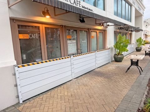 Flood protection panels installed outside a restaurant in Hollywood Beach to prevent water damage